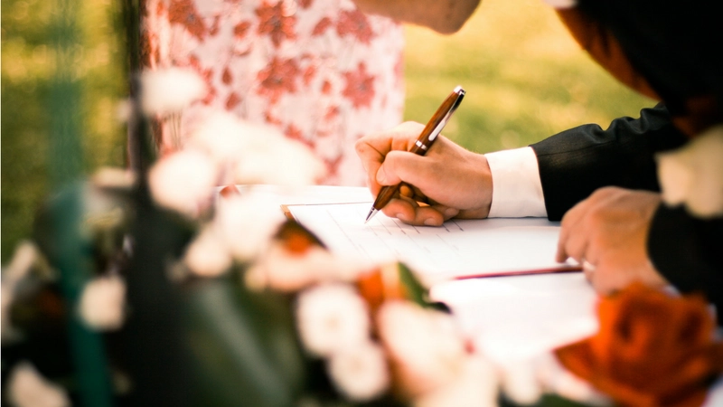 Signing a contract at an outdoor event